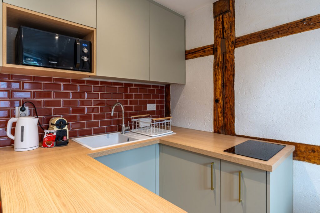 Coin cuisine d'un appartement de la conciergerie COCOONBNB à Strasbourg